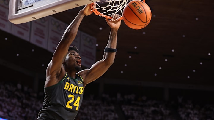 Feb 7, 2026; Ames, Iowa, USA; Baylor Bears guard Tounde Yessoufou (24) dunks in their game with the Iowa State Cyclones during the second half at James H. Hilton Coliseum. Mandatory Credit: Reese Strickland-Imagn Images