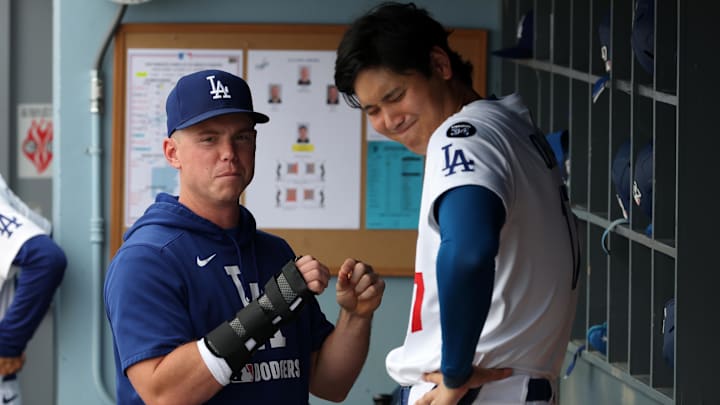 Sep 21, 2025; Los Angeles, California, USA; Los Angeles Dodgers injured catcher Will Smith (left) with his right hand in a brace talks with designated hitter Shohei Ohtani (17) during the eighth inning against the San Francisco Giants at Dodger Stadium. Mandatory Credit: Kiyoshi Mio-Imagn Images Sep 21, 2025; Los Angeles, California, USA; Los Angeles Dodgers injured catcher Will Smith (left) with his right hand in a brace talks with designated hitter Shohei Ohtani (17) during the eighth inning against the San Francisco Giants at Dodger Stadium. Mandatory Credit: Kiyoshi Mio-Imagn Images