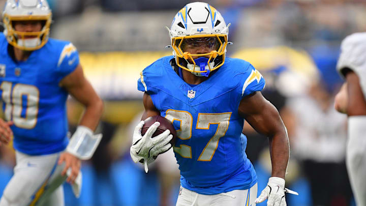 Oct 27, 2024; Inglewood, California, USA; Los Angeles Chargers running back J.K. Dobbins (27) runs the ball against the New Orleans Saints during the second half at SoFi Stadium. 