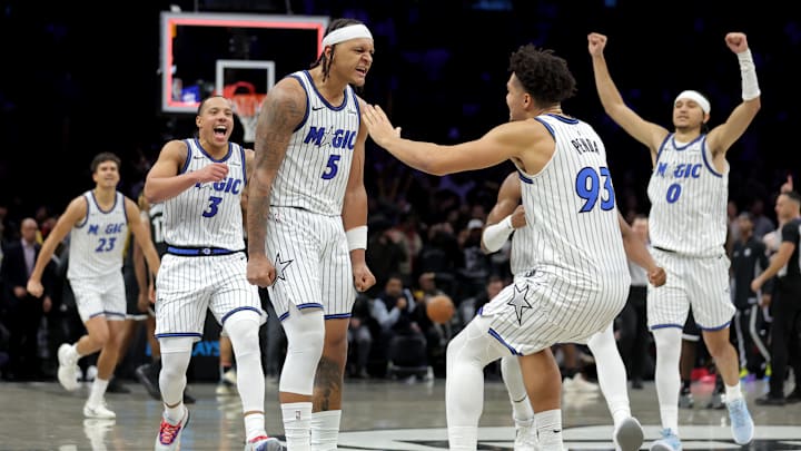 Jan 7, 2026; Brooklyn, New York, USA; Orlando Magic forward Paolo Banchero (5) celebrates with teammates after his overtime game-winning three point shot against the Brooklyn Nets at Barclays Center. Mandatory Credit: Brad Penner-Imagn Images