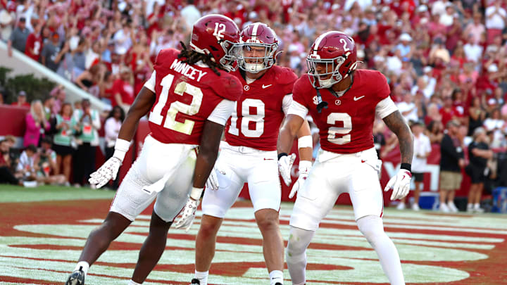 Oct 4, 2025; Tuscaloosa, Alabama, USA; Alabama Crimson Tide defensive back Zavier Mincey (12) celebrates his overturned interception with teammates during the second half against the Vanderbilt Commodores at Saban Field at Bryant-Denny Stadium. Mandatory Credit: David Leong-Imagn Images