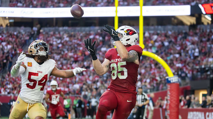 Jan 5, 2025; Glendale, Arizona, USA; Arizona Cardinals tight end Trey McBride (85) catches a touchdown pass against San Francisco 49ers linebacker Fred Warner (54) in the first half at State Farm Stadium. Mandatory Credit: Mark J. Rebilas-Imagn Images Jan 5, 2025; Glendale, Arizona, USA; Arizona Cardinals tight end Trey McBride (85) catches a touchdown pass against San Francisco 49ers linebacker Fred Warner (54) in the first half at State Farm Stadium. Mandatory Credit: Mark J. Rebilas-Imagn Images