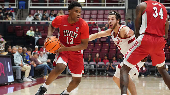 UNLV Runnin' Rebels guard Issac Williamson (12) uses a screen from center Emmanuel Stephen (34) on Stanford Cardinal guard Benny Gealer (5) in the first half at Maples Pavilion. Mandatory Credit: David Gonzales-Imagn Images