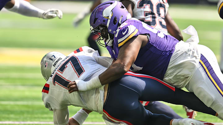 Aug 16, 2025; Minneapolis, Minnesota, USA; Minnesota Vikings defensive end Alex Williams (99) tackles New England Patriots quarterback Ben Wooldridge (17) during the fourth quarter at U.S. Bank Stadium. 
