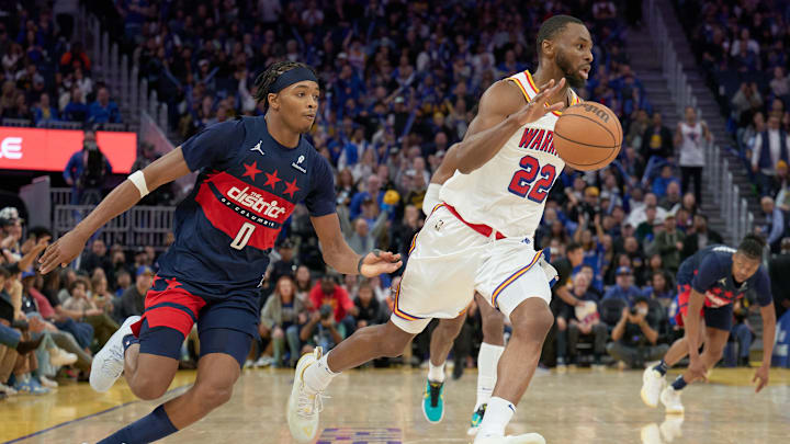 Jan 18, 2025; San Francisco, California, USA; Golden State Warriors forward Andrew Wiggins (22) drives with the ball against Washington Wizards guard Bilal Coulibaly (0) during the fourth quarter at Chase Center. Mandatory Credit: Robert Edwards-Imagn Images