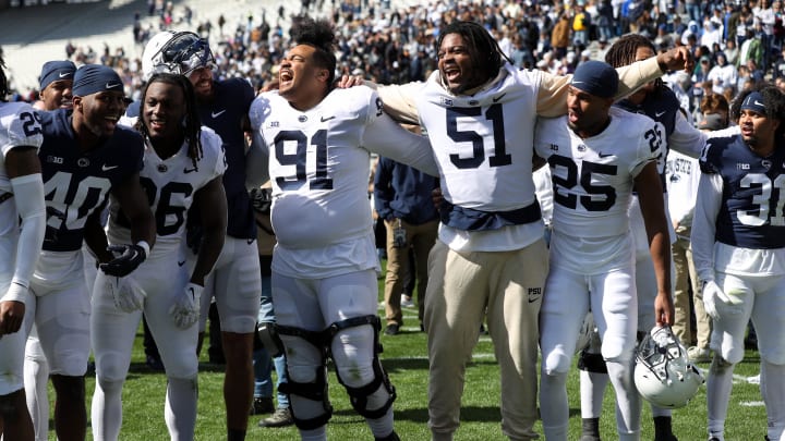 Penn State football players sing their alma mater following the conclusion of the Blue-White spring game at Beaver Stadium. Penn State football players sing their alma mater following the conclusion of the Blue-White spring game at Beaver Stadium.