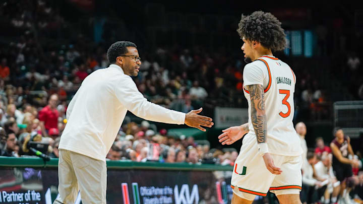 Mar 7, 2026; Coral Gables, Florida, USA; Miami Hurricanes head coach Jai Lucas congratulates guard Tre Donaldson (3) against the Louisville Cardinals during the second half at Watsco Center. Mandatory Credit: Jeff Romance-Imagn Images