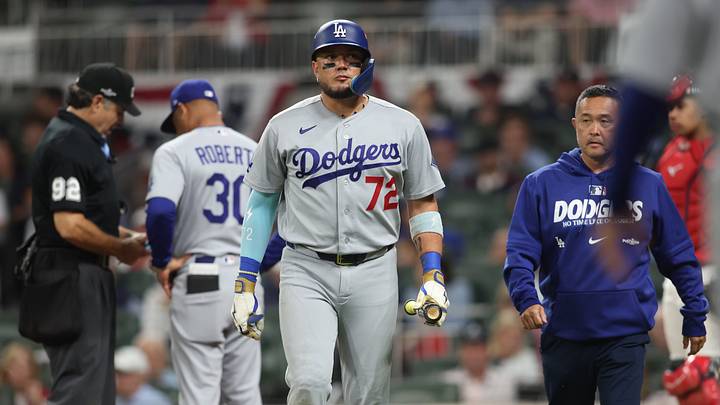 Oct 6, 2026; Cumberland, Georgia, USA; iLos Angeles Dodgers second baseman Miguel Rojas (72) leaves the game after hitting a foul ball off his body against the Atlanta Braves in game three of the NLDS for the 2026 MLB Playoffs at Truist Park. Mandatory Credit: Brett Davis-Imagn Images Oct 6, 2026; Cumberland, Georgia, USA; iLos Angeles Dodgers second baseman Miguel Rojas (72) leaves the game after hitting a foul ball off his body against the Atlanta Braves in game three of the NLDS for the 2026 MLB Playoffs at Truist Park. Mandatory Credit: Brett Davis-Imagn Images