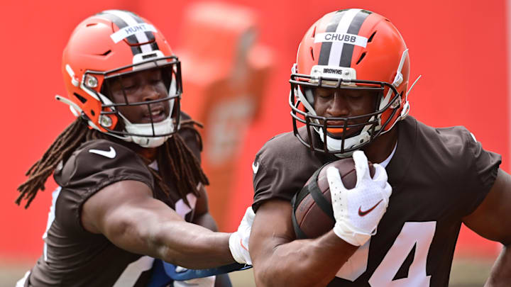 May 25, 2022; Berea, OH, USA; Cleveland Browns running back Kareem Hunt (27) and running back Nick Chubb (24) run a drill during organized team activities at CrossCountry Mortgage Campus. Mandatory Credit: Ken Blaze-Imagn Images