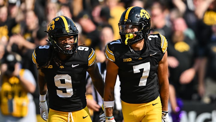 Oct 12, 2024; Iowa City, Iowa, USA; Iowa Hawkeyes defensive back John Nestor (7) and running back Jaziun Patterson (9) react after a touchdown by Nestor during the fourth quarter at Kinnick Stadium.