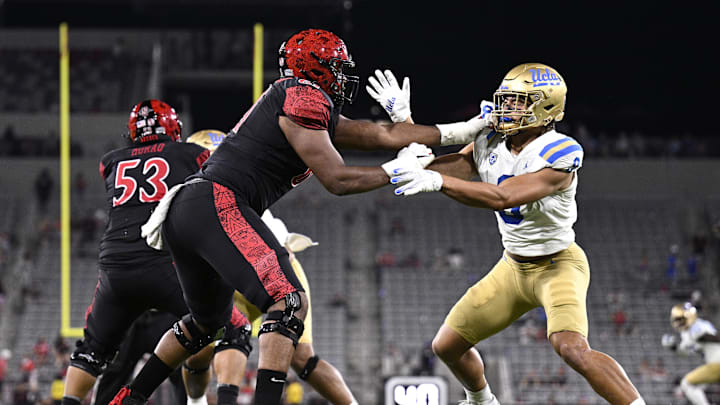 Sep 9, 2023; San Diego, California, USA; UCLA Bruins linebacker Choe Bryant-Strother (9) battles