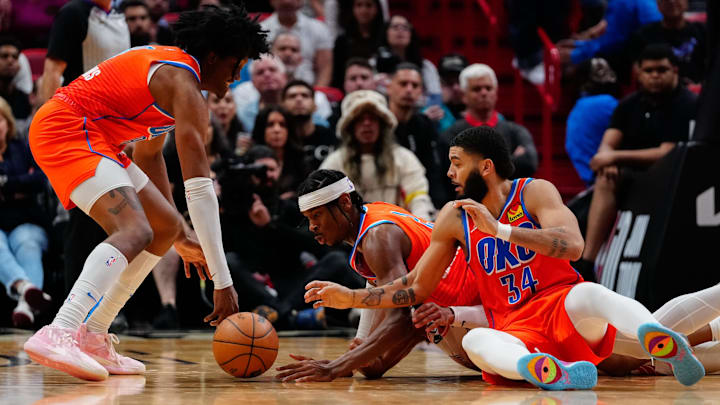 Jan 10, 2023; Miami, Florida, USA; Oklahoma City Thunder forward Jalen Williams (8) and guard Shai Gilgeous-Alexander (2)and forward Kenrich Williams (34) dive to get a loose ball against the Miami Heat during the second half at FTX Arena. Mandatory Credit: Rich Storry-Imagn Images Jan 10, 2023; Miami, Florida, USA; Oklahoma City Thunder forward Jalen Williams (8) and guard Shai Gilgeous-Alexander (2)and forward Kenrich Williams (34) dive to get a loose ball against the Miami Heat during the second half at FTX Arena. Mandatory Credit: Rich Storry-Imagn Images