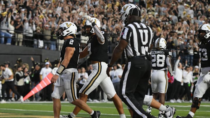 Oct 25, 2025; Nashville, Tennessee, USA; Vanderbilt Commodores quarterback Diego Pavia (2) celebrates his one-yard touchdown run against the Missouri Tigers during the fourth quarter at FirstBank Stadium. Mandatory Credit: Steve Roberts-Imagn Images Oct 25, 2025; Nashville, Tennessee, USA; Vanderbilt Commodores quarterback Diego Pavia (2) celebrates his one-yard touchdown run against the Missouri Tigers during the fourth quarter at FirstBank Stadium. Mandatory Credit: Steve Roberts-Imagn Images