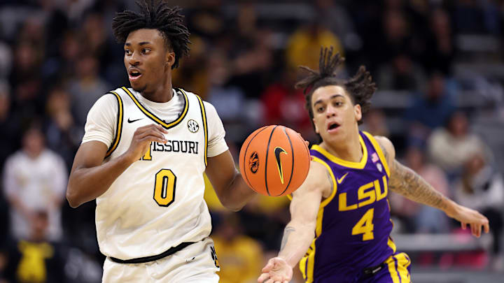 Missouri Tigers guard Anthony Robinson II (0) facilitates the court in a game against the LSU Tigers this season.