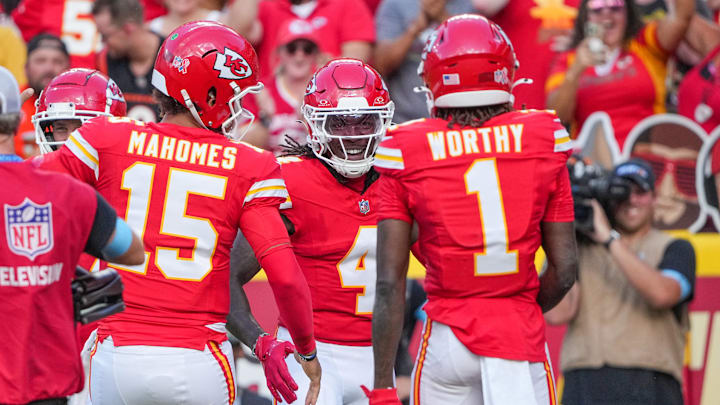 Sep 15, 2024; Kansas City, Missouri, USA; Kansas City Chiefs wide receiver Rashee Rice (4) celebrates after scoring against the Cincinnati Bengals during the game at GEHA Field at Arrowhead Stadium. Mandatory Credit: Denny Medley-Imagn Images