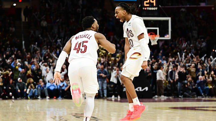 Jan 8, 2025; Cleveland, Ohio, USA; Cleveland Cavaliers guard Donovan Mitchell (45) and guard Darius Garland (10) celebrate after Mitchell made a three point basket during the second half against the Oklahoma City Thunder at Rocket Mortgage FieldHouse. Mandatory Credit: Ken Blaze-Imagn Images