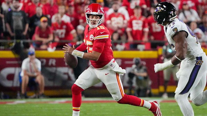 Sep 5, 2024; Kansas City, Missouri, USA; Kansas City Chiefs quarterback Patrick Mahomes (15) runs the ball against the Baltimore Ravens during the game at GEHA Field at Arrowhead Stadium. Mandatory Credit: Denny Medley-Imagn Images