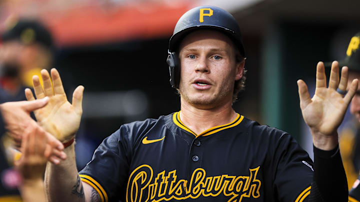 Sep 23, 2025; Cincinnati, Ohio, USA; Pittsburgh Pirates outfielder Jack Suwinski (65) high fives teammates after scoring on a RBI single hit by second baseman Nick Yorke (not pictured) in the second inning against the Cincinnati Reds at Great American Ball Park. Mandatory Credit: Katie Stratman-Imagn Images