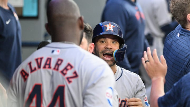 Jul 2, 2024; Toronto, Ontario, CAN;  Houston Astros second baseman Jose Altuve (27) celebrates in the dugout after left fielder Yordan Alvarez (44) hit a three-run home run against the Toronto Blue Jays in the fifth inning at Rogers Centre. 