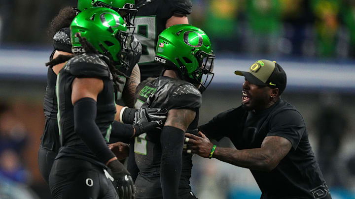 Oregon Ducks defensive back Nikko Reed (9) celebrates an interception Sunday, Dec. 8, 2024, during the Big Ten Championship game at Lucas Oil Stadium in Indianapolis. The Oregon Ducks defeated the Penn State Nittany Lions, 45-37.