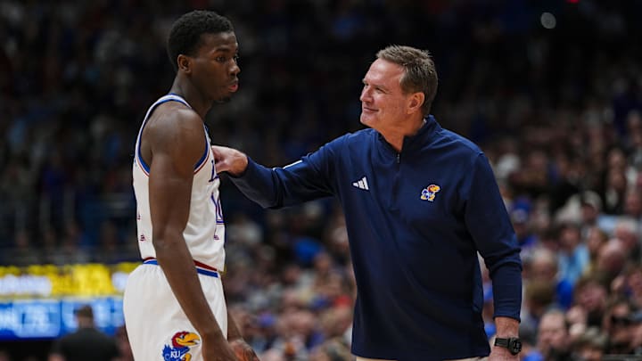Jan 13, 2026; Lawrence, Kansas, USA; Kansas Jayhawks head coach Bill Self talks with guard Melvin Council Jr. (14) during the second half against the Iowa State Cyclones.