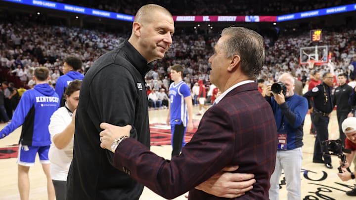 Jan 31, 2026; Fayetteville, Arkansas, USA; Kentucky Wildcats head coach Mark Pope shakes hands with Arkansas Razorbacks head coach John Calipari prior to the game at Bud Walton Arena. Kentucky won 85-77. Mandatory Credit: Nelson Chenault-Imagn Images