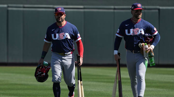 Mar 4, 2026; Scottsdale, AZ, USA; United States designated hitter Kyle Schwarber (12) and United States first baseman Bryce Harper (24) arrive to the game against the Colorado Rockies at Salt River Fields. Mandatory Credit: Rick Scuteri-Imagn Images Mar 4, 2026; Scottsdale, AZ, USA; United States designated hitter Kyle Schwarber (12) and United States first baseman Bryce Harper (24) arrive to the game against the Colorado Rockies at Salt River Fields. Mandatory Credit: Rick Scuteri-Imagn Images