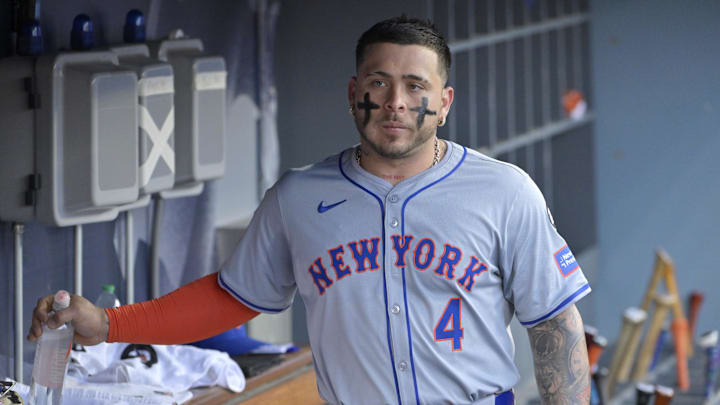 Oct 20, 2024; Los Angeles, California, USA; New York Mets catcher Francisco Alvarez (4) looks on in the dugout before game six against the Los Angeles Dodgers in the NLCS for the 2024 MLB playoffs at Dodger Stadium. Mandatory Credit: Jayne Kamin-Oncea-Imagn Images