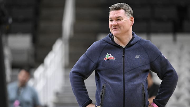 Mar 25, 2026; San Jose, CA, USA; Arizona Wildcats head coach Tommy Lloyd smiles during a practice session ahead of the west regional of the men's 2026 NCAA Tournament at SAP Center. Mandatory Credit: Eakin Howard-Imagn Images