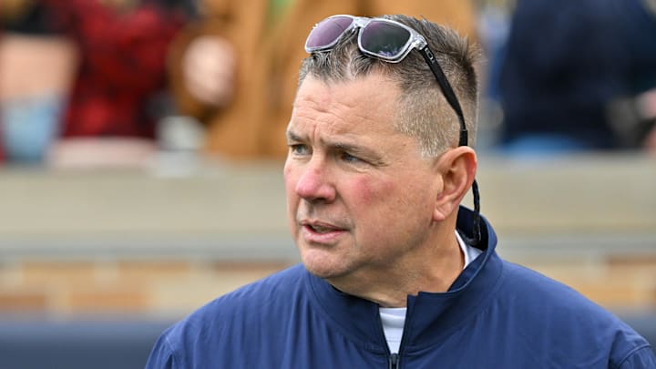 Nov 16, 2024; South Bend, Indiana, USA; Notre Dame Fighting Irish defensive coordinator Al Golden watches warmups before a game against the Virginia Cavaliers at Notre Dame Stadium. 
