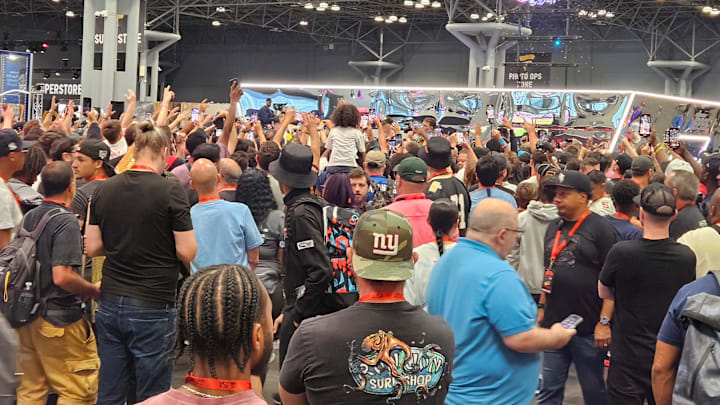 The crowd at Fanatics Fest surrounds the Topps booth where Travis Scott hands out the limited-edition release of Cactus Jack trading cards on Aug. 17.  Photo by Susan Lulgjuraj.