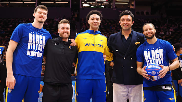 Golden State Warriors center Quinten Post (21), guard Pat Spencer (61), forward Trayce Jackson-Davis (32), former player Zaza Pachulia and guard Stephen Curry (30) are recognized for their participation in the All-star weekend before the game against the Orlando Magic at Chase Center. Mandatory Credit: Kelley L Cox-Imagn Images Golden State Warriors center Quinten Post (21), guard Pat Spencer (61), forward Trayce Jackson-Davis (32), former player Zaza Pachulia and guard Stephen Curry (30) are recognized for their participation in the All-star weekend before the game against the Orlando Magic at Chase Center. Mandatory Credit: Kelley L Cox-Imagn Images