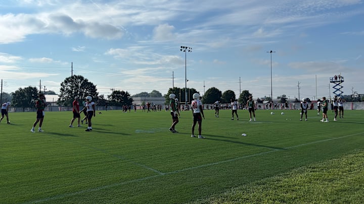 Louisville football players make their way onto the practice fields during fall camp. Louisville football players make their way onto the practice fields during fall camp.