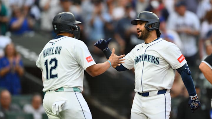 Aug 5, 2025; Seattle, Washington, USA; Seattle Mariners first baseman Josh Naylor (12) and third baseman Eugenio Suarez (28) celebrate after Suarez hit a 2-run home run against the Chicago White Sox during the fourth inning at T-Mobile Park. Mandatory Credit: Steven Bisig-Imagn Images Aug 5, 2025; Seattle, Washington, USA; Seattle Mariners first baseman Josh Naylor (12) and third baseman Eugenio Suarez (28) celebrate after Suarez hit a 2-run home run against the Chicago White Sox during the fourth inning at T-Mobile Park. Mandatory Credit: Steven Bisig-Imagn Images