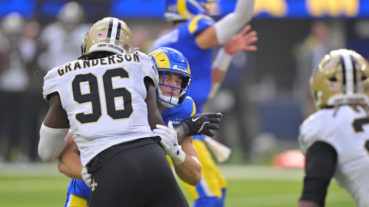 Nov 2, 2025; Inglewood, California, USA; Los Angeles Rams defensive tackle Ty Hamilton (57) blocks New Orleans Saints defensive end Carl Granderson (96) during the first half at SoFi Stadium. Mandatory Credit: Jayne Kamin-Oncea-Imagn Images