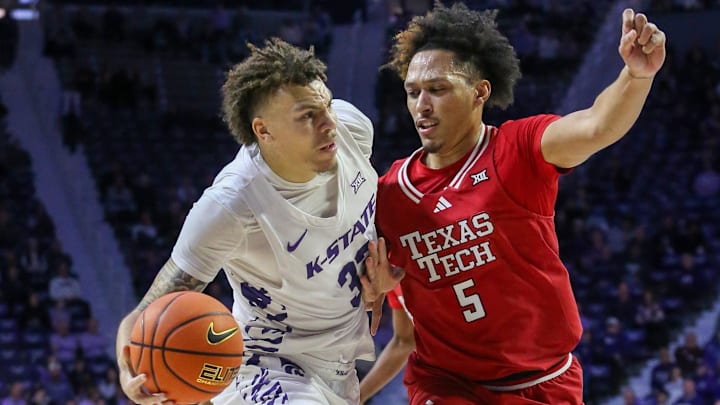 Jan 14, 2025; Manhattan, Kansas, USA; Kansas State Wildcats forward Coleman Hawkins (33) is guarded by Texas Tech Red Raiders forward Darrion Williams (5) during the first half at Bramlage Coliseum. Mandatory Credit: Scott Sewell-Imagn Images
