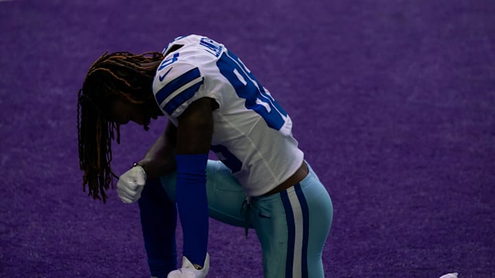 Dallas Cowboys wide receiver CeeDee Lamb takes a knee before a game against the Minnesota Vikings at U.S. Bank Stadium. 