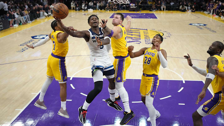 Oct 24, 2025; Los Angeles, California, USA; Los Angeles Lakers center Deandre Ayton (5) shoots the ball against Los Angeles Lakers guard Gabe Vincent (7), guard Luka Doncic (77) and forward Rui Hachimura (28) in the second half at Crypto.com Arena. Mandatory Credit: Kirby Lee-Imagn Images Oct 24, 2025; Los Angeles, California, USA; Los Angeles Lakers center Deandre Ayton (5) shoots the ball against Los Angeles Lakers guard Gabe Vincent (7), guard Luka Doncic (77) and forward Rui Hachimura (28) in the second half at Crypto.com Arena. Mandatory Credit: Kirby Lee-Imagn Images