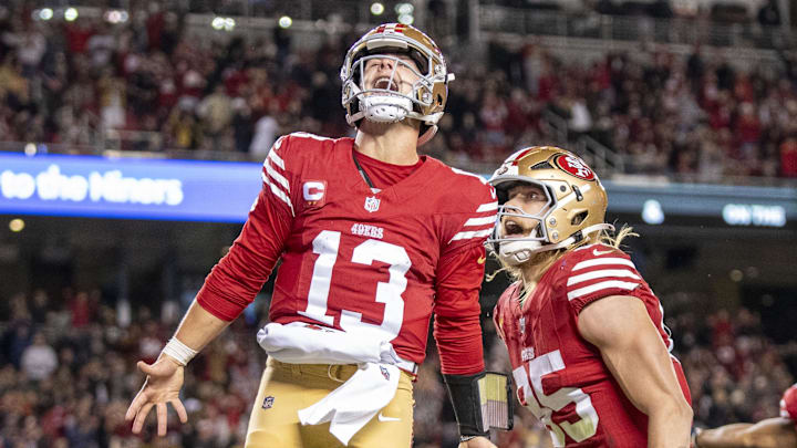 December 30, 2024; Santa Clara, California, USA; San Francisco 49ers quarterback Brock Purdy (13) celebrates with tight end George Kittle (85) after scoring a touchdown against the Detroit Lions during the second quarter at Levi's Stadium. Mandatory Credit: Kyle Terada-Imagn Images