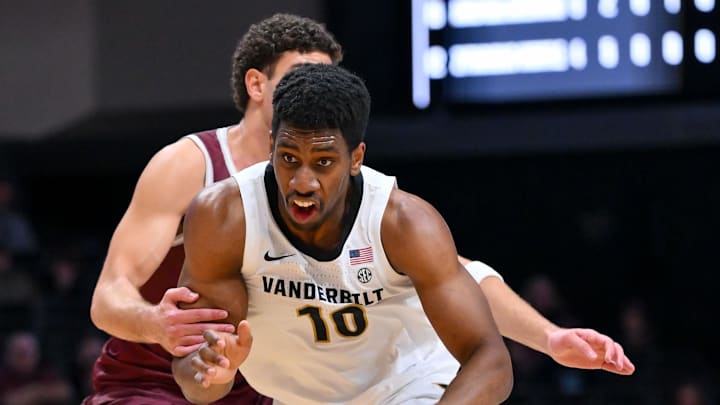 Nov 20, 2025; Nashville, Tennessee, USA;  Vanderbilt Commodores forward Jalen Washington (13) drives to the basket past Texas Southern Tigers guard Ahmed Nedal Abdelrahman (15) during the second half at Memorial Gymnasium. Mandatory Credit: Steve Roberts-Imagn Images