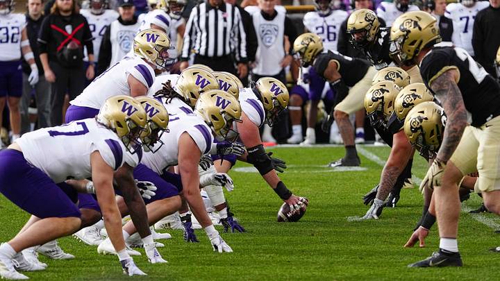 The Huskies line up against Colorado in their 2021 game in Boulder.