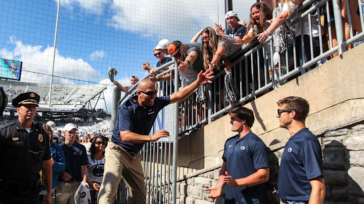 Penn State football coach James Franklin celebrates with students at Beaver Stadium following a Nittany Lions game.