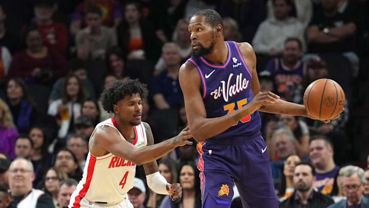 Feb 29, 2024; Phoenix, Arizona, USA; Houston Rockets guard Jalen Green (4) guards Phoenix Suns forward Kevin Durant (35) during the first half at Footprint Center. Mandatory Credit: Joe Camporeale-Imagn Images