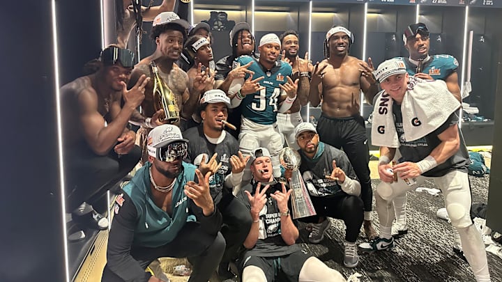 Cooper DeJean (right) and his Eagles defensive back teammates celebrate inside the locker room after beating the Kansas City Chiefs in Super Bowl LIX on Feb. 9. Cooper DeJean (right) and his Eagles defensive back teammates celebrate inside the locker room after beating the Kansas City Chiefs in Super Bowl LIX on Feb. 9.