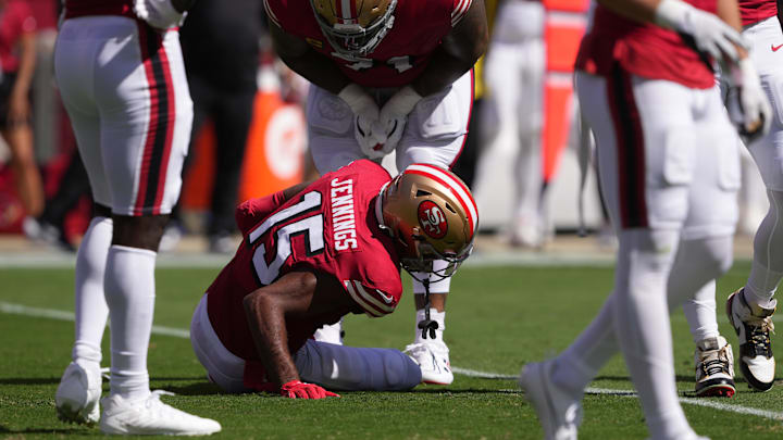 Oct 6, 2024; Santa Clara, California, USA; San Francisco 49ers wide receiver Jauan Jennings (15) is checked on by offensive tackle Trent Williams (center top) after suffering an injury against the Arizona Cardinals during the first quarter at Levi's Stadium. Mandatory Credit: Darren Yamashita-Imagn Images Oct 6, 2024; Santa Clara, California, USA; San Francisco 49ers wide receiver Jauan Jennings (15) is checked on by offensive tackle Trent Williams (center top) after suffering an injury against the Arizona Cardinals during the first quarter at Levi's Stadium. Mandatory Credit: Darren Yamashita-Imagn Images