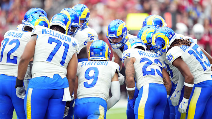 Sep 15, 2024; Glendale, Arizona, USA; Los Angeles Rams quarterback Matthew Stafford (9) huddles teammates against the Arizona Cardinals during the first half at State Farm Stadium. Mandatory Credit: Joe Camporeale-Imagn Images