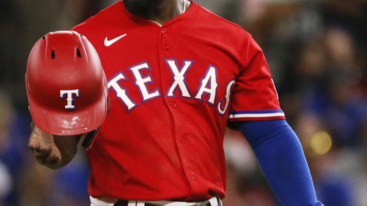 Jun 4, 2021; Arlington, Texas, USA; Texas Rangers right fielder Adolis Garcia (53) toss his batting helmet as he is forced out to end the third inning against the Tampa Bay Rays at Globe Life Field. Mandatory Credit: Raymond Carlin III-Imagn Images