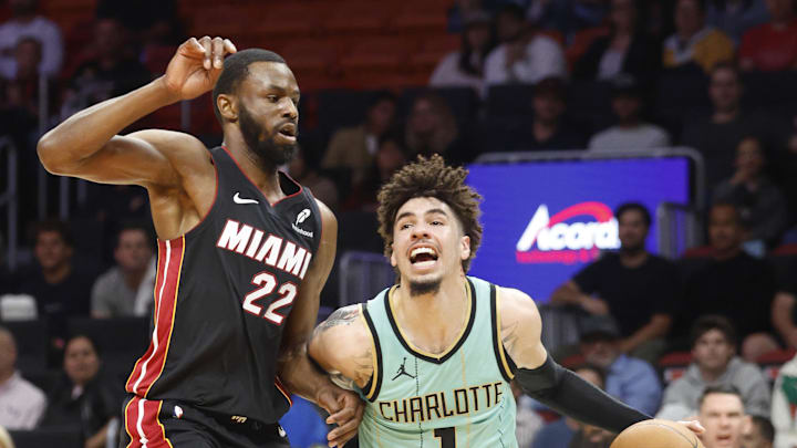 Mar 23, 2025; Miami, Florida, USA; Miami Heat forward Andrew Wiggins (22) defends Charlotte Hornets guard LaMelo Ball (1) during the first half at Kaseya Center. Mandatory Credit: Rhona Wise-Imagn Images Mar 23, 2025; Miami, Florida, USA; Miami Heat forward Andrew Wiggins (22) defends Charlotte Hornets guard LaMelo Ball (1) during the first half at Kaseya Center. Mandatory Credit: Rhona Wise-Imagn Images