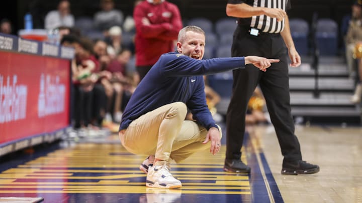 Nov 17, 2025; Morgantown, West Virginia, USA; West Virginia Mountaineers head coach Ross Hodge yells from the sideline during the second half against the Lafayette Leopards at WVU Coliseum. Mandatory Credit: Ben Queen-Imagn Images