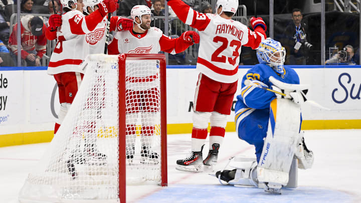 Oct 28, 2025; St. Louis, Missouri, USA; Detroit Red Wings right wing Alex Debrincat (93) is congratulated by teammates after scoring against St. Louis Blues goaltender Jordan Binnington (50) during the first period at Enterprise Center. Mandatory Credit: Jeff Curry-Imagn Images